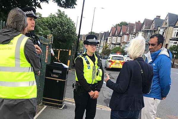 Shaffaq Mohammed speaking with the police at Endcliffe Park