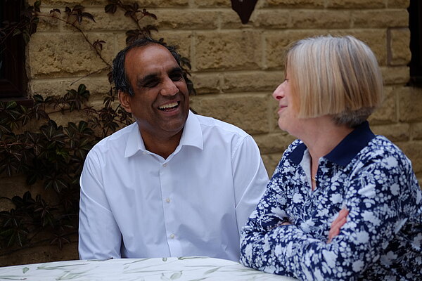 Shaffaq Mohammed speaking to a local resident