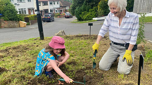 Cllr Barbara Masters planting wildflowers